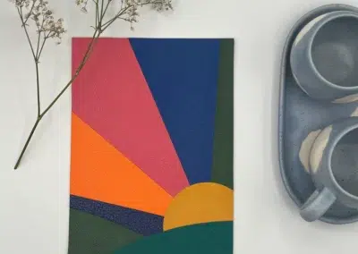 Carte colorée avec motif de lever de soleil